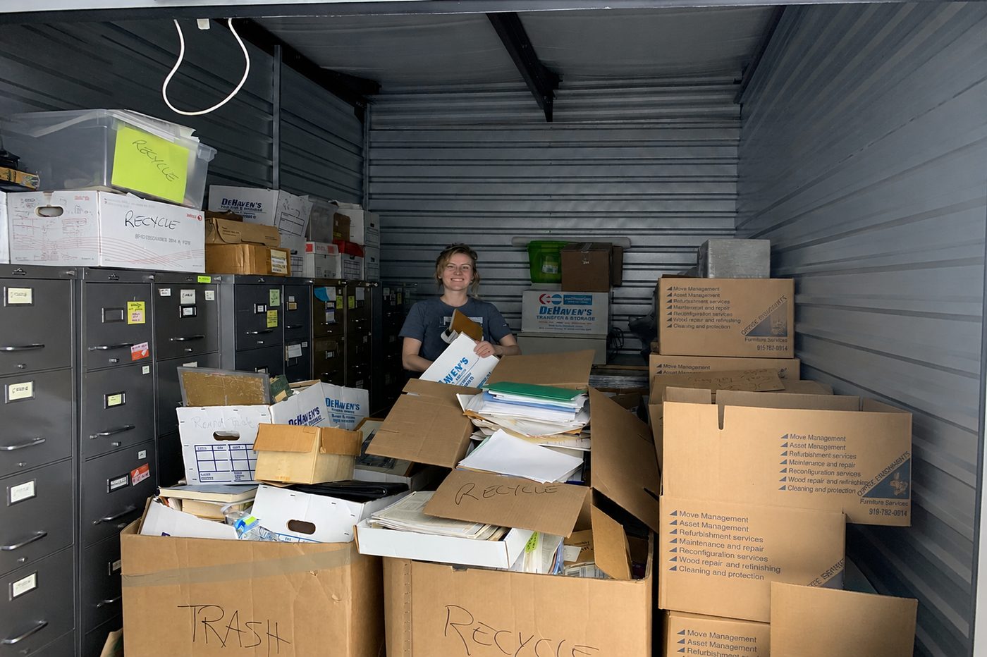 A Here to Home team member clearing out a storage unit during a final clear-out